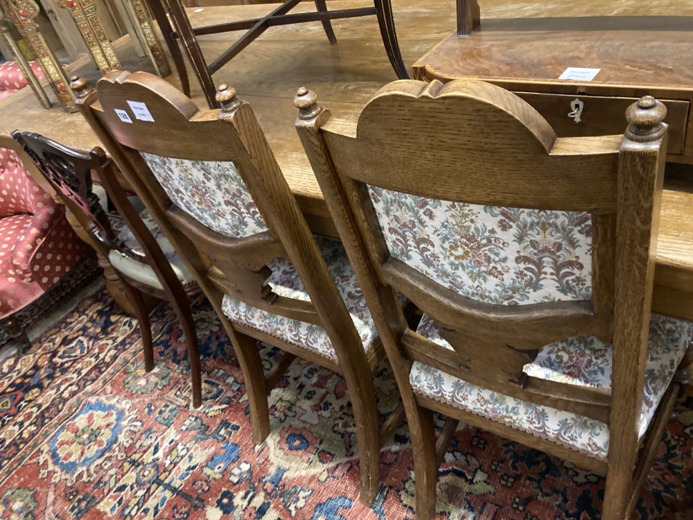 A set of four late Victorian carved oak dining chairs and a pair of Edwardian carved mahogany bedroom chairs (6)